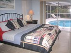 2923.tn-vacation_homes_in_marco_island_house_rental_-_king_bed_in_master_bedroom_wmaster_bath_roll_out_of_bed_and_into_the_pool_.jpg